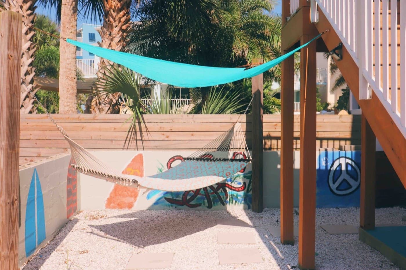 Relax in a shaded hammock oasis with tropical vibes and coastal charm